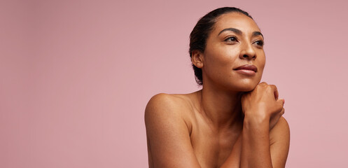 pretty woman with healthy skin looking away