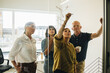 © Jacob Lund - Team developing business plan on glass wall