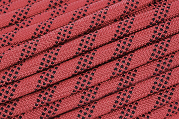 Abseil rope background showing hiking safety equipment extreme sports shops.