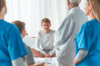 © Photographee.eu - Senior grey doctor and female young intern working together at hospital