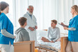 © Photographee.eu - Profession doctors and helpful nurses with patients trying to find diagnose