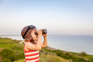 Happy child against blue sea and sky background