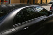 The car is covered with black vinyl, matte finish, anti-scratch and dustproof.