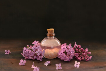 Wall Mural - Lilac flowers, lilac oil in bottle, spa