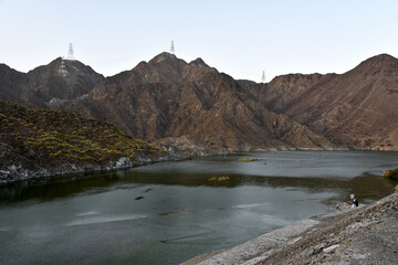 Sticker - Mesmerizing scenery of a river and mountains in Al Rafisah Dam, Khorfakkan, United Arab Emirates