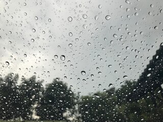 rain water drops on the window glass texture.
