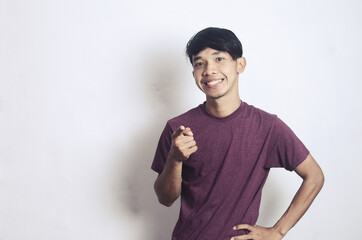 a young Asian man with a happy cheerful expression on a white background