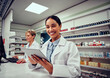© StratfordProductions - Cheerful happy pharmacist chemist woman working in pharmacy drugstore