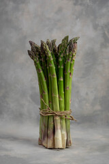 Sticker - Bunch of green asparagus isolated on grey.