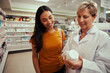 © StratfordProductions - Senior pharmacy woman helping female customer find bottle of medicine from shelves