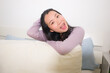 © TheVisualsYouNeed - lifestyle portrait of young and beautiful Asian woman at home -  attractive and happy Korean girl gesturing playful and cheerful on bed smiling relaxed