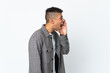 © luismolinero - Young brazilian man isolated on white background shouting with mouth wide open to the side