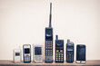 © reshoot - Group of old and obsolete mobile phone or cell phone on old wood with a light rough background