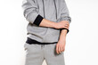 © Sergey - man in a gray tracksuit on a white background