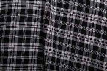 Checkered black and white shirt fabric texture. Cloth surface.