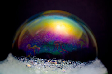 The colorful world of soap bubbles resembling space and honeycomb