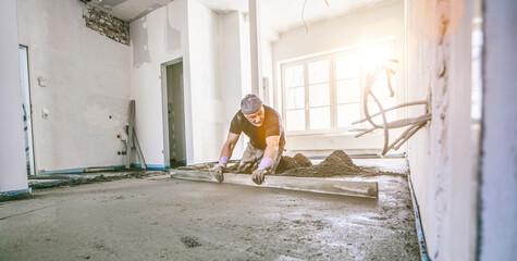 filling the floor of a renovated apartment with concrete, screed and leveling the floor by construct