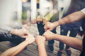 Close-up of the hands of people of different races, contracting trust and cooperation.