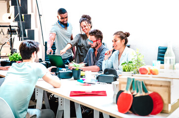 Young people employees group working at computer in startup studio - Human resources business and teamwork concept on laptop brainstorming time - Start up entrepreneurs at office - Bright vivid filter