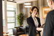 © bnenin - Agreeing with her colleagues, hand shaking.