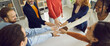 © Studio Romantic - Banner with group of positive multiracial teammates, business partners, or friends joining hands. Teamwork, team unity, project kickoff, workshop with coach and mentor, participation, success concept