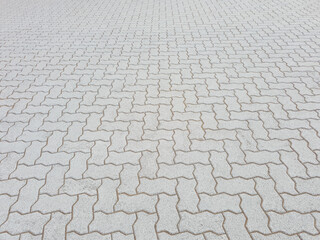 Interlocking concrete paver tiles in clean perspective view.