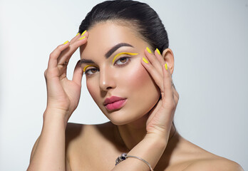 Poster - beauty model girl with fashion make-up, bright yellow eye line and nails, trendy manicure. eye make-