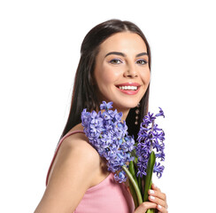 Wall Mural - Beautiful young woman with hyacinth flowers on white background