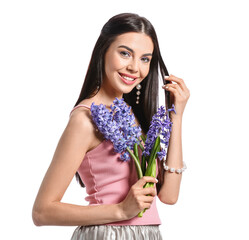 Wall Mural - Beautiful young woman with hyacinth flowers on white background