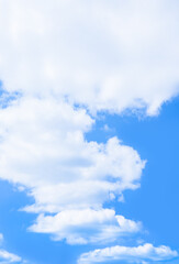 Wall Mural - soft cumulus clouds floating over bright and clear blue sky on sunny day. pure white cloudscape scen