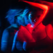 © golubovy - Mental disorder. Abstract portrait. Schizophrenia depression. Defocused double exposure silhouette of disturbed anxious woman in red blue neon light on aged black background.