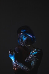 cosmic beauty. art portrait. fantasy creation. mysterious alien woman silhouette in blue galaxy nebu