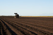 © SuperStock - Tractor preparing rows of soil for sugarcane