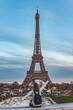 © Adolf - Young girl on vacation in paris with the Eiffel tower in the background