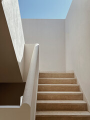 modern building with beige walls, stairs and sunlight shadows. abstract architecture facade design c