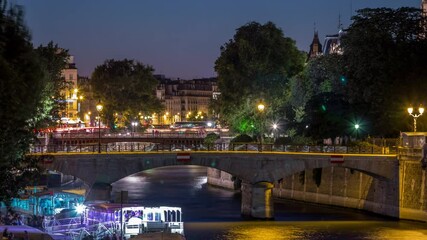 Wall Mural - River and bridge near Notre Dame De Paris cathedral day to night timelapse after sunset.