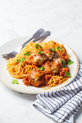 Canvas Print - Spaghetti with meatballs, cheese and tomato sauce in white dish.