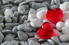 Romantic Background With Two Red Hearts On Gray And White Pebbles With A Blank Space For Text. A Blank For A Valentine's Day Greeting Card. A Marine Style Wedding Invitation.