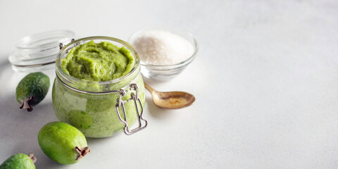 Wall Mural - Feijoa jam with sugar in a jar on a light background. Iodine product