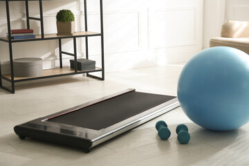 Sticker - Modern walking treadmill, dumbbells and fitness ball in living room. Home gym equipment