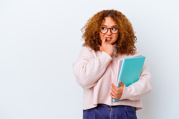 Wall Mural - Young student woman over isolated background relaxed thinking about something looking at a copy space.