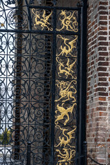 Wall Mural - ancient and beautiful gates delicately forged in a blacksmith in the architectural interior 