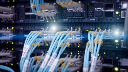 Sticker - fiber optic and hub in server room. close up. telecommunication concept.