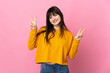 © luismolinero - Young Ukrainian woman isolated on pink background showing victory sign with both hands