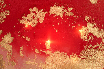 gold and ruby red pattern with texture of geode and sparkles. abstract vector background in alcohol 