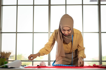 Wall Mural - Muslim women run a small business in their own homes