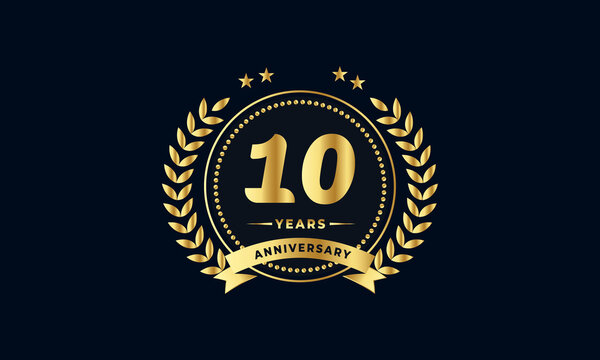 10th golden anniversary logo, with shiny ring and golden ribbon, laurel wreath isolated on navy blue background