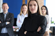 © H_Ko - Portrait of strict businesswoman against background of business colleagues