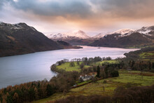 Snowcapped Mountain Range On A Moody Winters Morning At Ullswater In The Lake District, UK. 