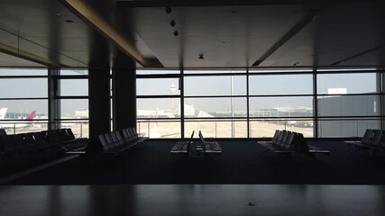 Canvas Print - Inside passenger terminal in Shanghai Pudong Airport without passenger walking in terminal. Coronavirus 2019/ COVID-19 crisis in Asia.